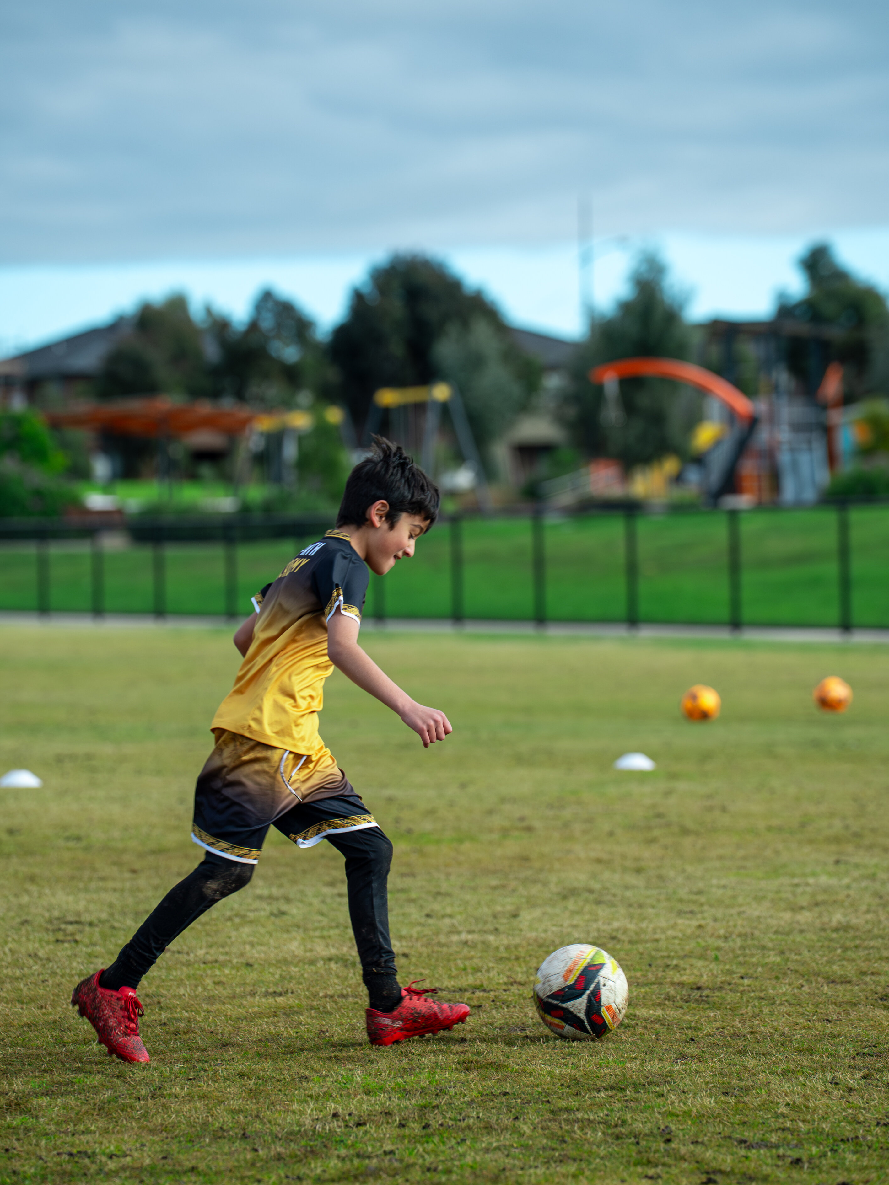 Young player running with the ball during a ProPath Academy session